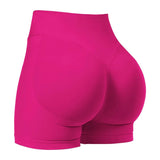 Pink athletic shorts on a white background