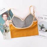 Gray and mustard yellow bralette on a magazine background