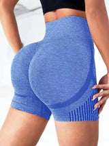 Blue athletic shorts worn by a person on a plain background