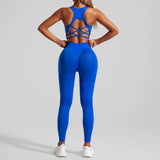 Person wearing a blue sports outfit with criss-cross back design on a gray background