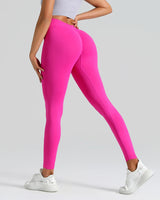 Person wearing bright pink leggings on a light gray background