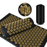 Acupressure mat with gold acupressure nodes and black carrying bag on a white background