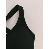 Black swimsuit top on a mannequin against a white background
