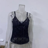 Black lace camisole on a transparent mannequin against a white background