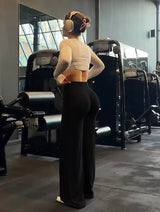 Person exercising in a gym wearing headphones