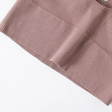Close-up of a ribbed pink fabric on a white background
