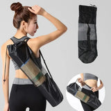 Woman wearing a black drawstring bag over her shoulder with additional images of the bag on a gray background.