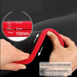 Red strap being stretched with a close-up of its thickness and hands holding it.