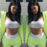 Two identical images of a person wearing a bright green outfit with a white top.