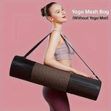 Woman holding a yoga mesh bag without a yoga mat on a pink background
