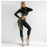 Woman wearing a black and green athletic outfit on a white background