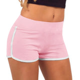 Pink athletic shorts with white trim on a white background