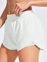 White shorts worn by a person on a light gray background