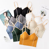 Collection of various colored camisoles on a magazine background