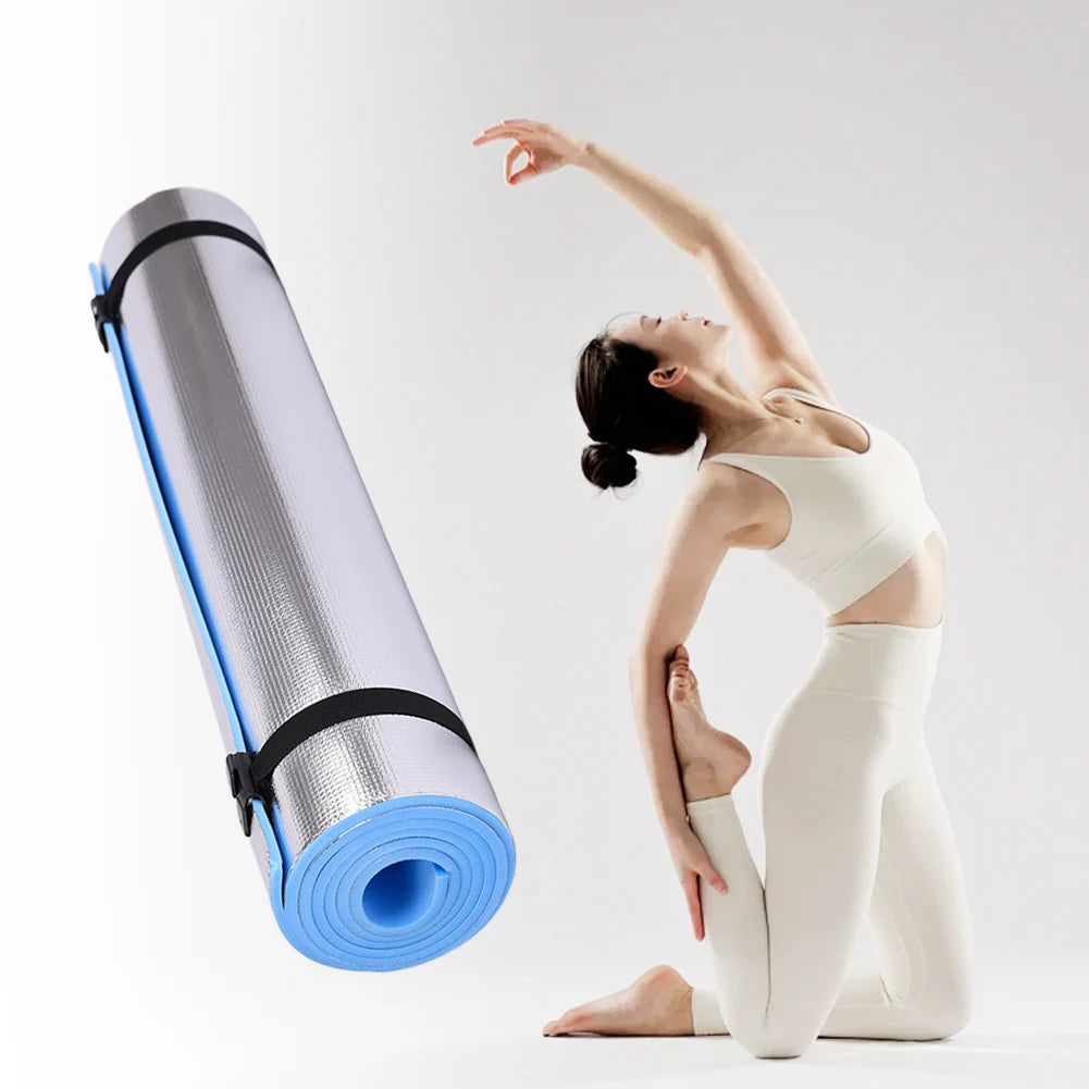 Athletic Sanctuary 10mm EVA yoga mat with thick, anti-slip surface for exercise and camping activities, lying on a wooden floor.