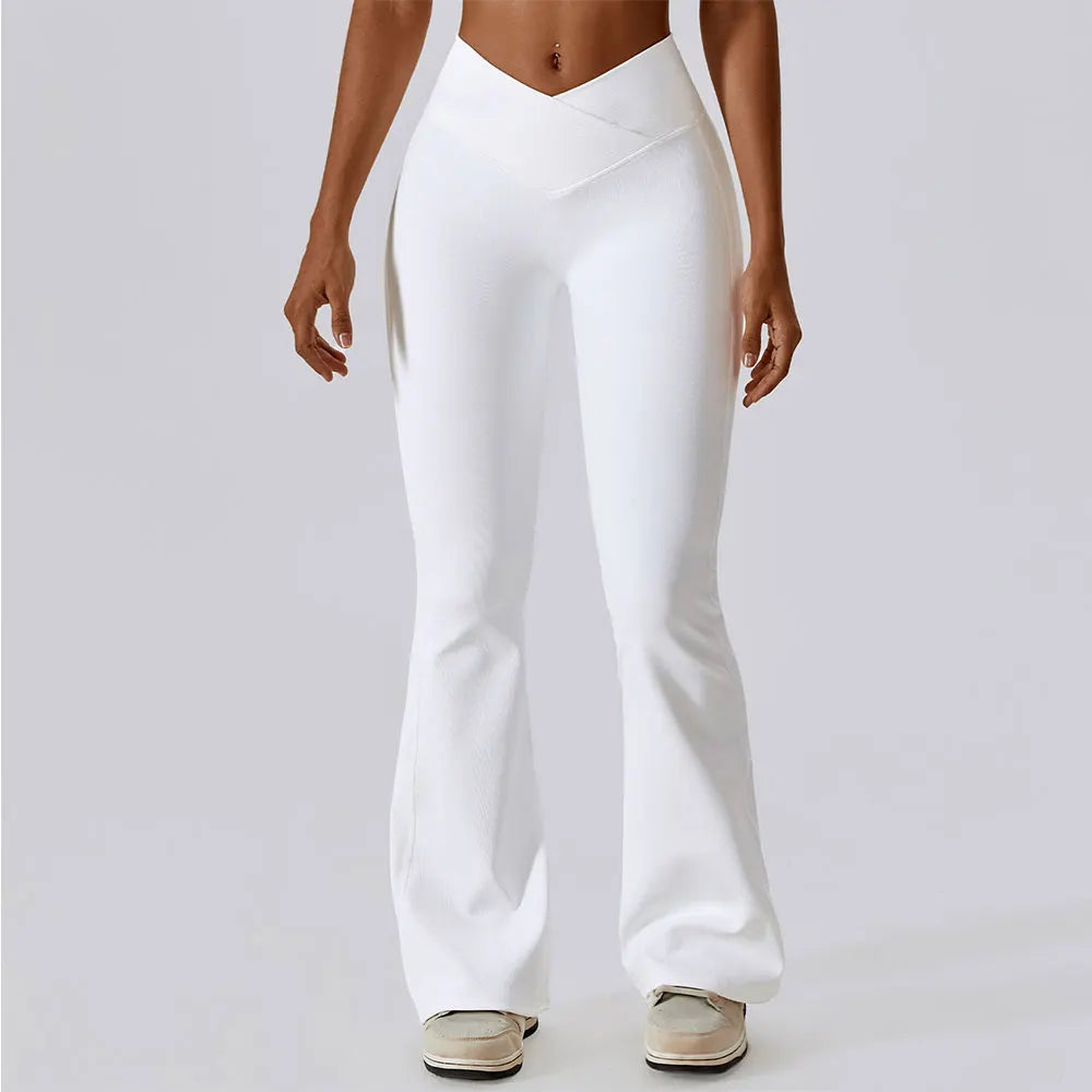 Women’s high-waist flared leggings from Athletic Sanctuary featuring a sculpting fit and flowing style, shown on a model.