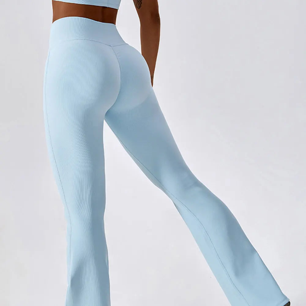Women's high-waist flared leggings by Athletic Sanctuary, showing a close-up of the sculpting fit and flowing fabric design.