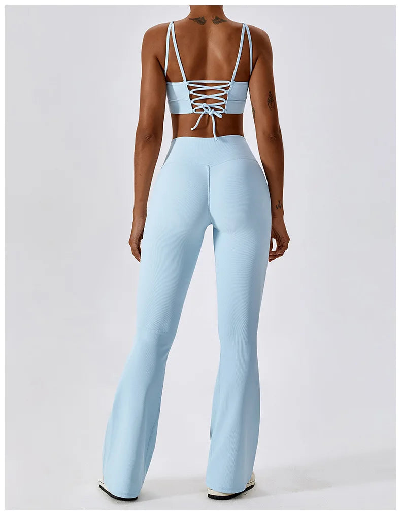 Women’s high-waist flared leggings from Athletic Sanctuary, showcasing a sculpted fit and flowing flared design on a model.