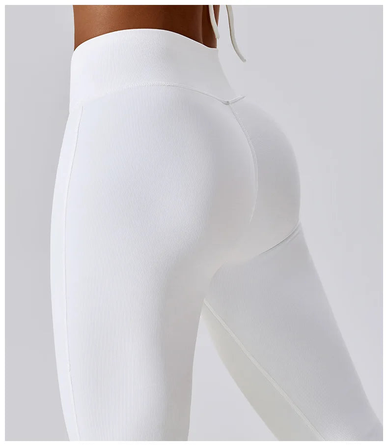 Women's high-waist flared leggings by Athletic Sanctuary, showcasing a sleek, sculpted fit with flowing flare design.