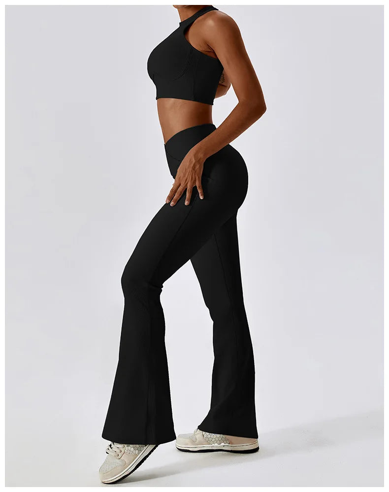 Women’s high-waist flared leggings by Athletic Sanctuary featuring a sculpting fit and flow design, shown in black fabric.