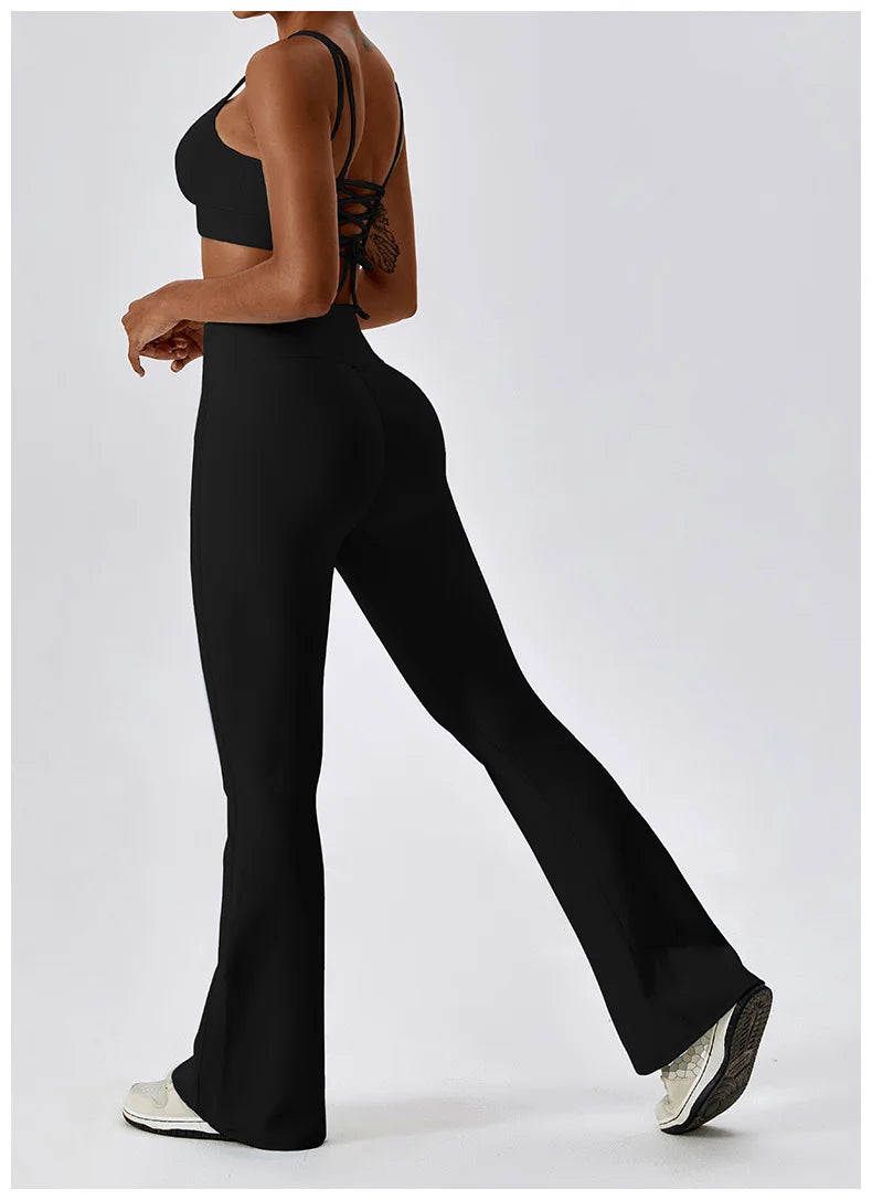 Women’s high-waist flared leggings from Athletic Sanctuary featuring a sculpting fit and flowing style, shown on a model.