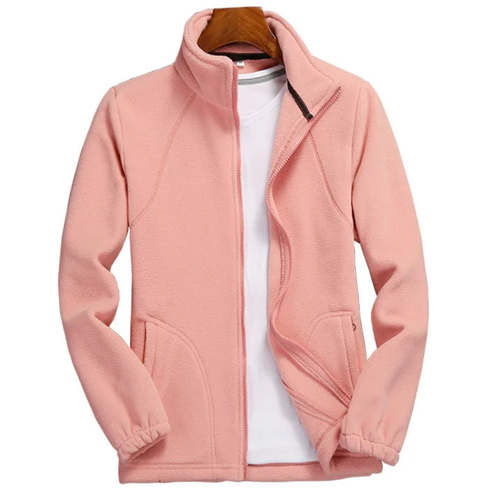 Woman wearing Athletic Sanctuary women's warm fleece zip-up sweatshirt, casual running jacket in a solid color.