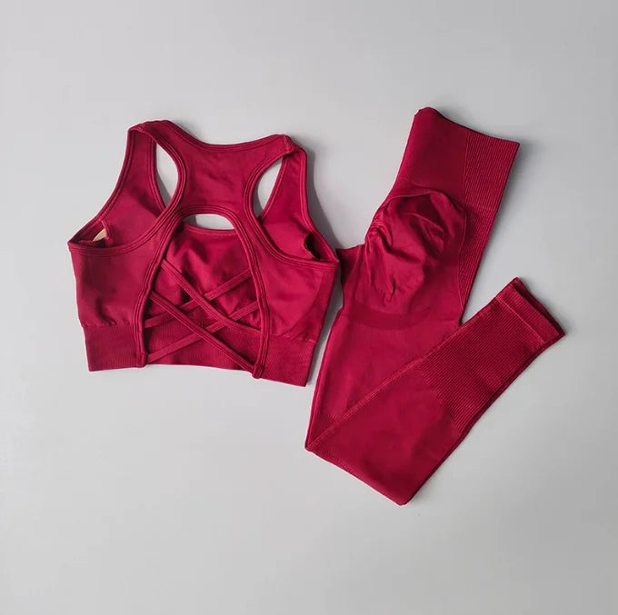 Women’s seamless gym set with high waist leggings and sports bra by Athletic Sanctuary, shown on a model in a workout pose.