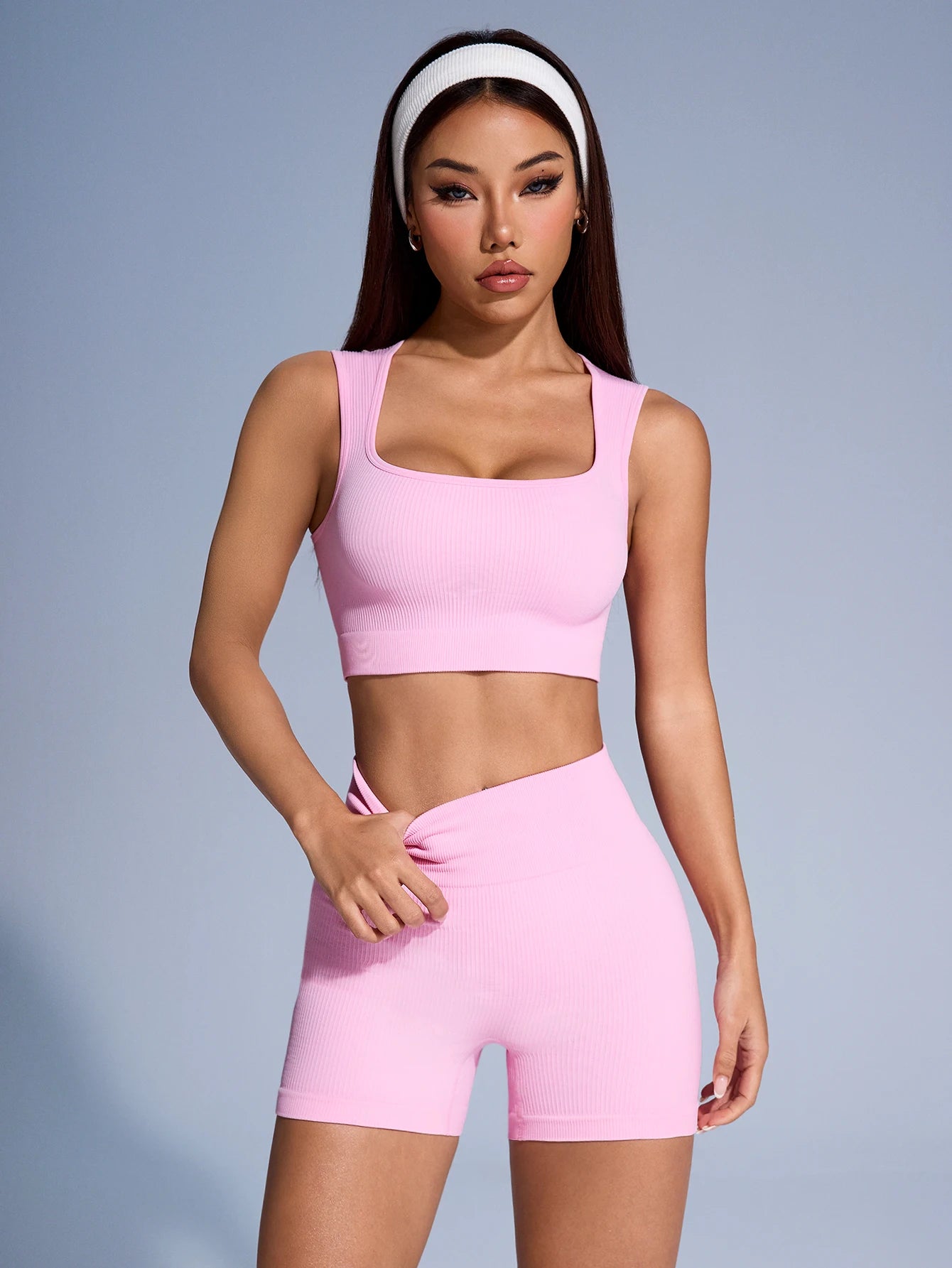 Women's seamless ribbed workout set by Athletic Sanctuary, includes crop tank and high-waist shorts for gym and fitness.
