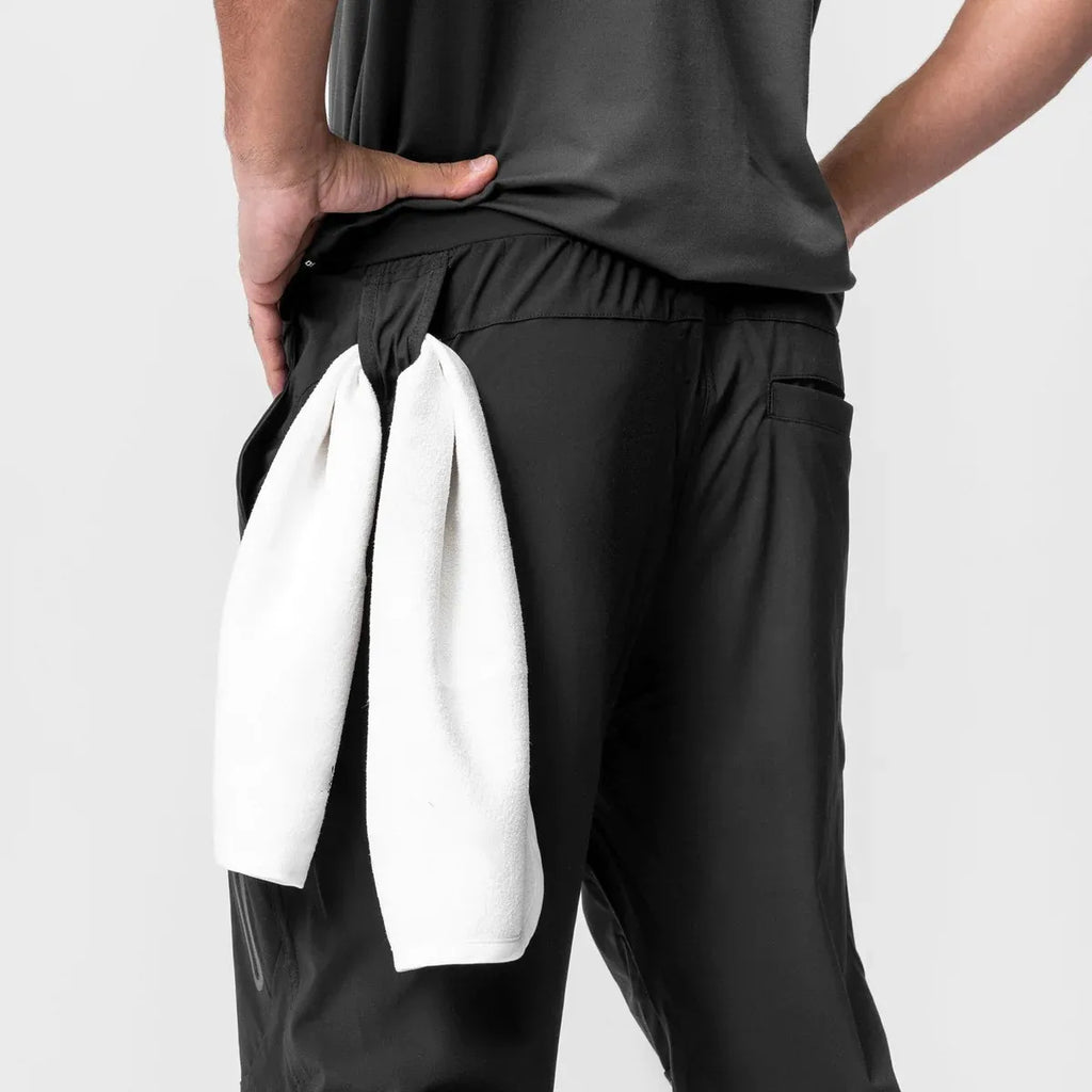 Men’s slim fit joggers by Athletic Sanctuary, fitness training and gym sweatpants, shown in black with tapered legs and elastic waistband.