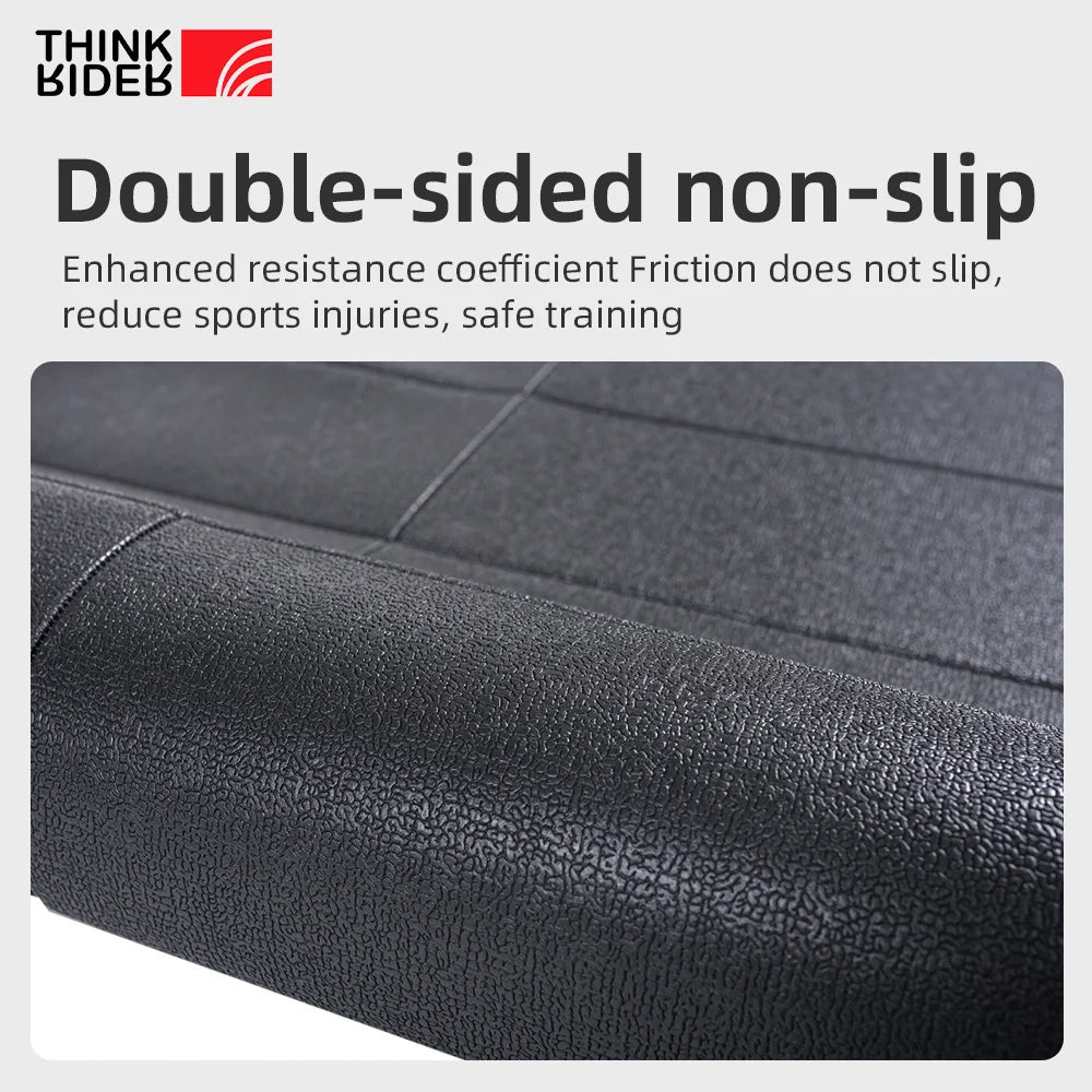 Athletic Sanctuary ThinkRider indoor bike trainer floor mat laid out on a workout space, protecting floors during cycling training.