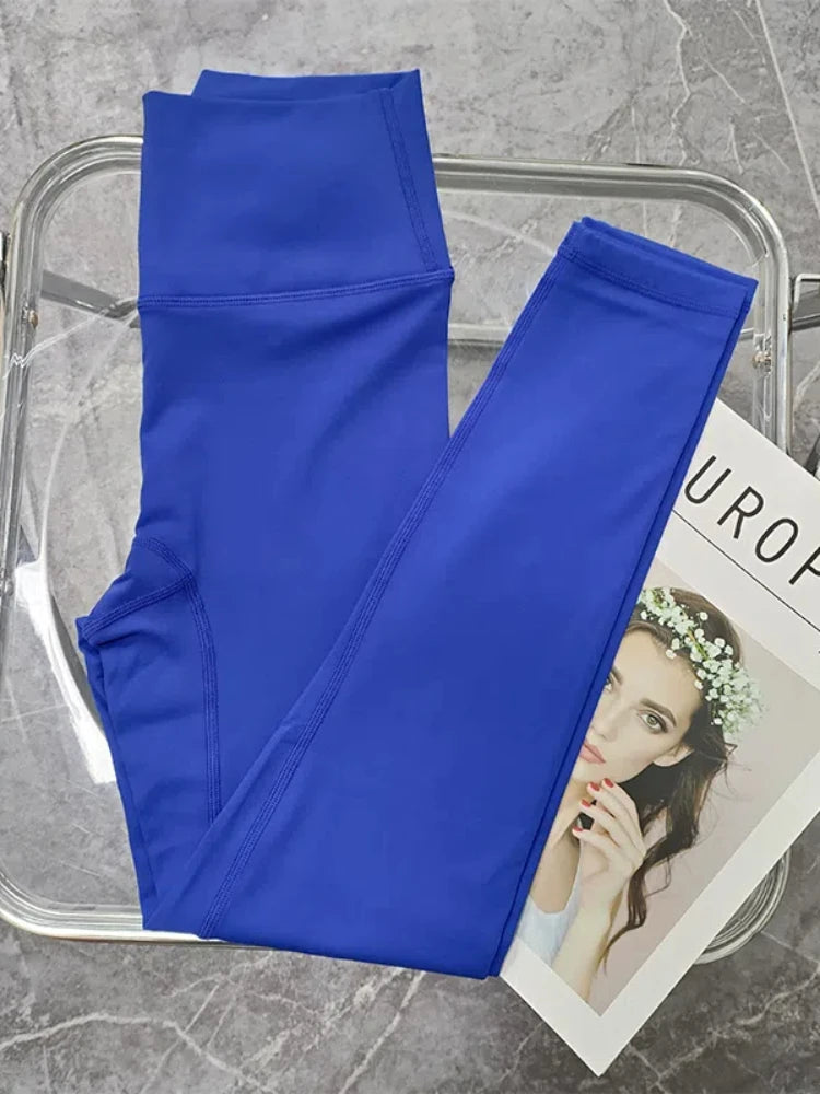 Women’s seamless yoga set with push-up sports bra and high waist leggings by Athletic Sanctuary, shown on a model in a workout pose.