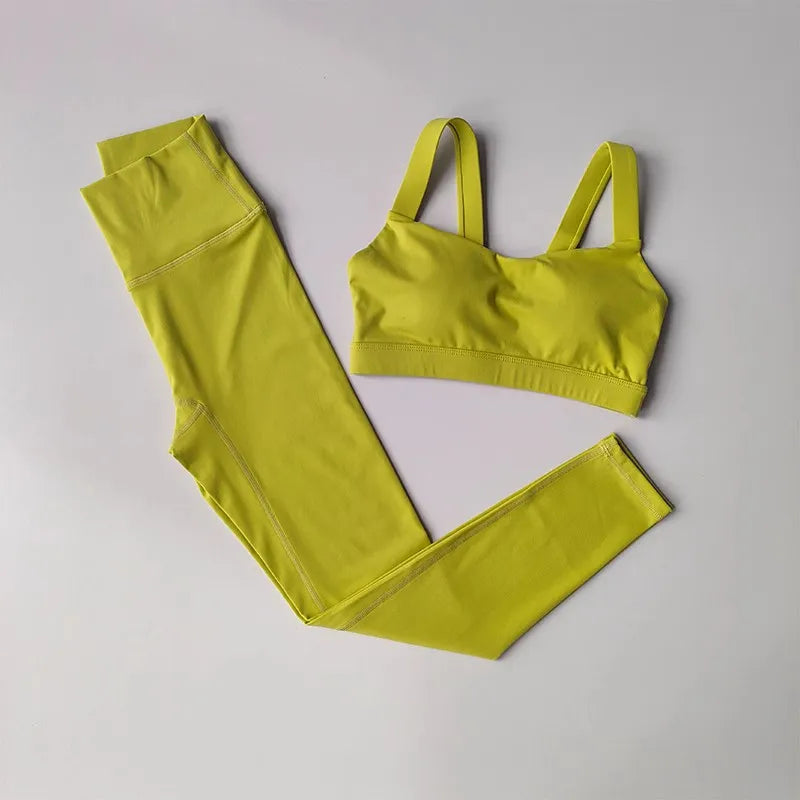 Women’s seamless yoga set with push-up sports bra and high-waist leggings by Athletic Sanctuary, shown in black on a model.