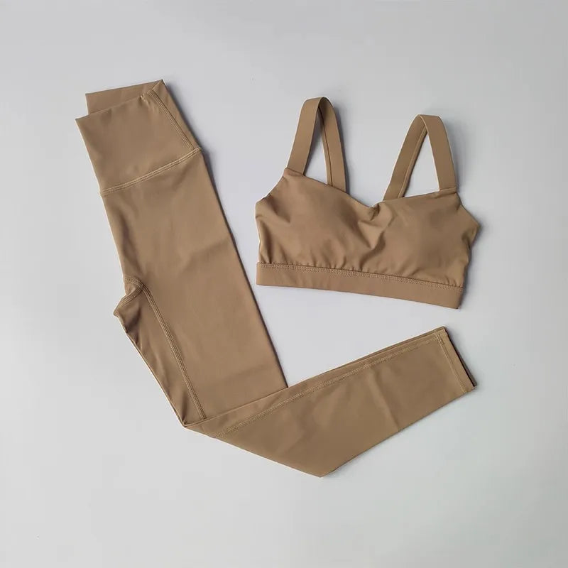 Women’s seamless yoga set by Athletic Sanctuary with push-up sports bra and high-waist leggings, shown in a comfortable, flexible fit.