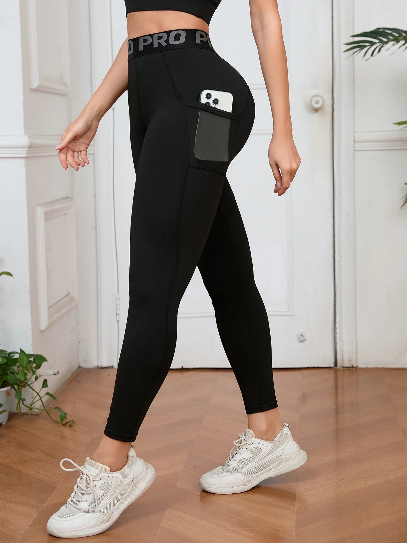 Women’s high waist yoga leggings by Athletic Sanctuary, stretchy workout pants with pockets for comfortable active wear.