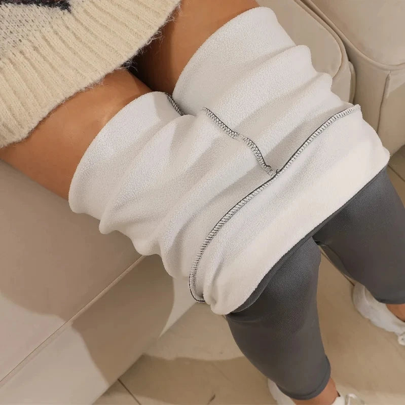 Women’s warm high-waisted leggings from Athletic Sanctuary, soft winter stretch tights showing a close-up of the fitted design and fabric texture.