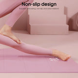 Person in pink leggings using Athletic Sanctuary 4MM EVA yoga mat with anti-slip surface for exercise and Pilates workouts.