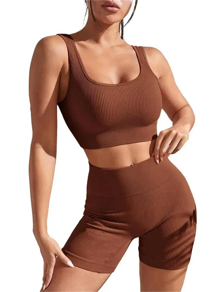 Women’s seamless ribbed workout set with crop tank and high-waist shorts, ideal for running and gym sessions by Athletic Sanctuary.