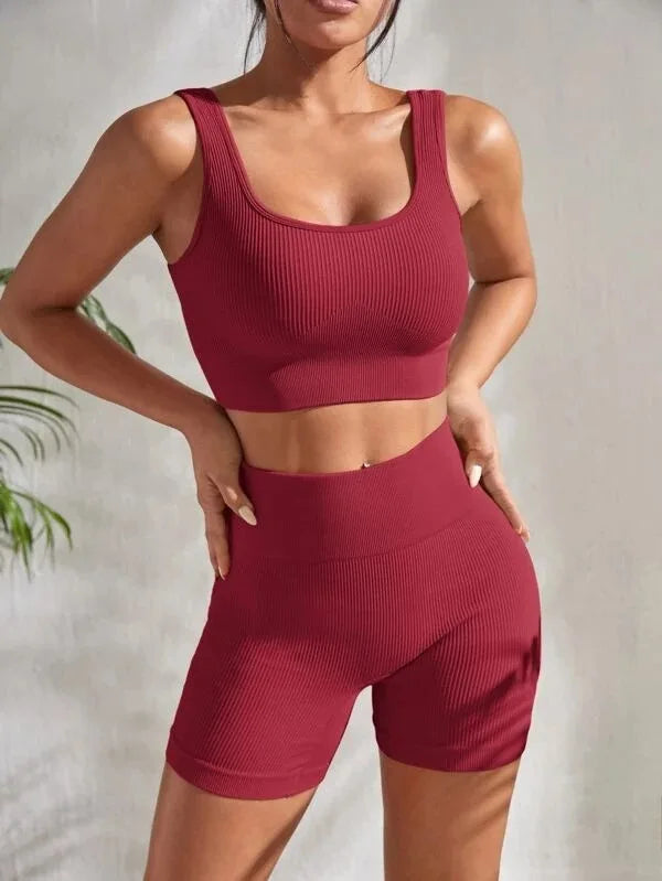 Maroon women's seamless ribbed workout set with crop tank and high-waist shorts from Athletic Sanctuary.