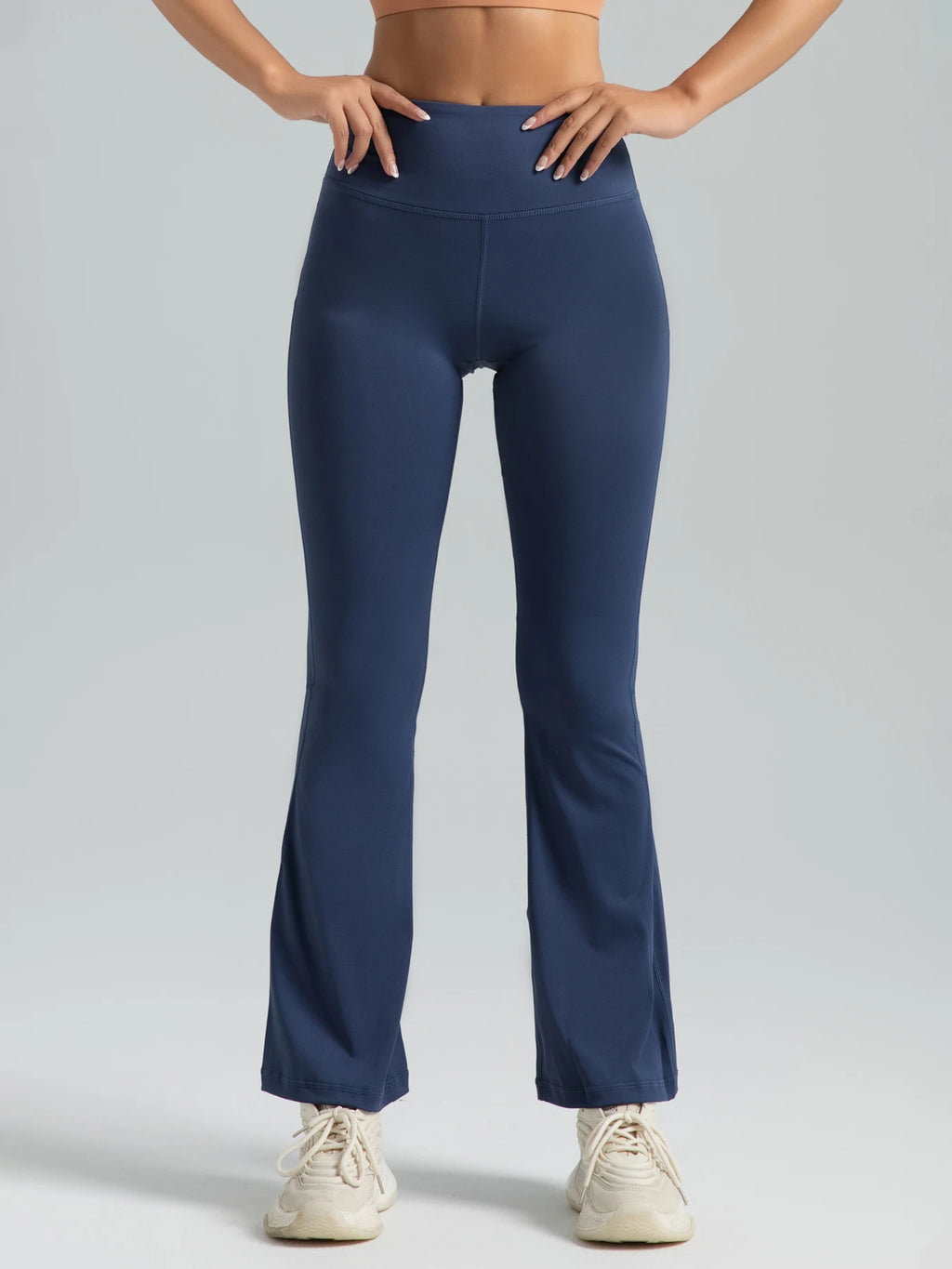 Women wearing Athletic Sanctuary high-waist flared yoga pants with supportive fit, ideal for workouts and casual wear.