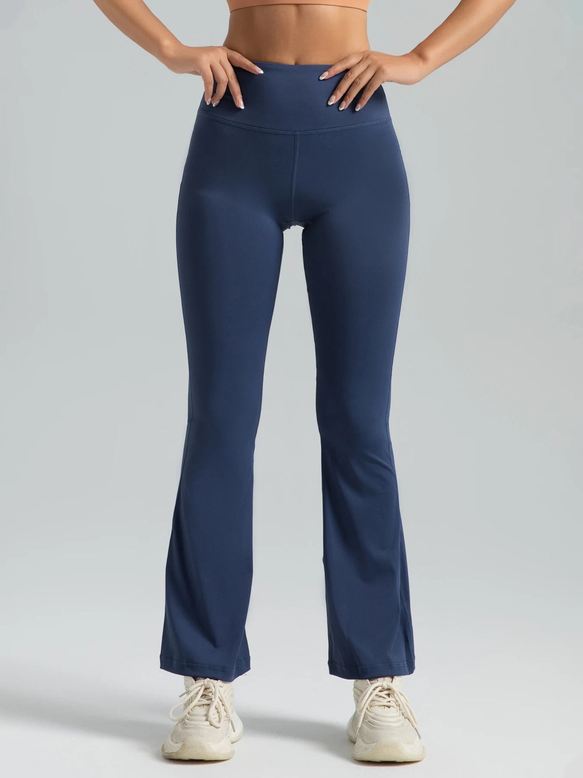 Women wearing Athletic Sanctuary high-waist flared yoga pants with supportive fit, ideal for workouts and casual wear.