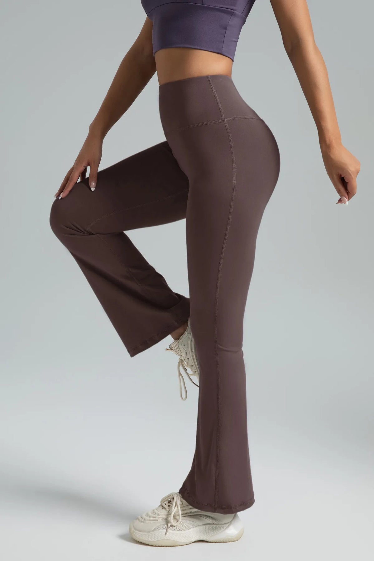 High-waist flared yoga pants by Athletic Sanctuary, featuring a supportive fit for workouts and everyday wear, shown in black fabric.