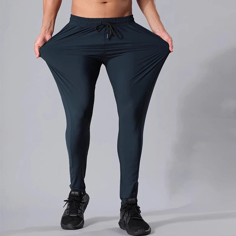 Men’s athletic sanctuary streetwear joggers with casual fit, perfect for gym, track, or everyday wear, shown in dark gray fabric.