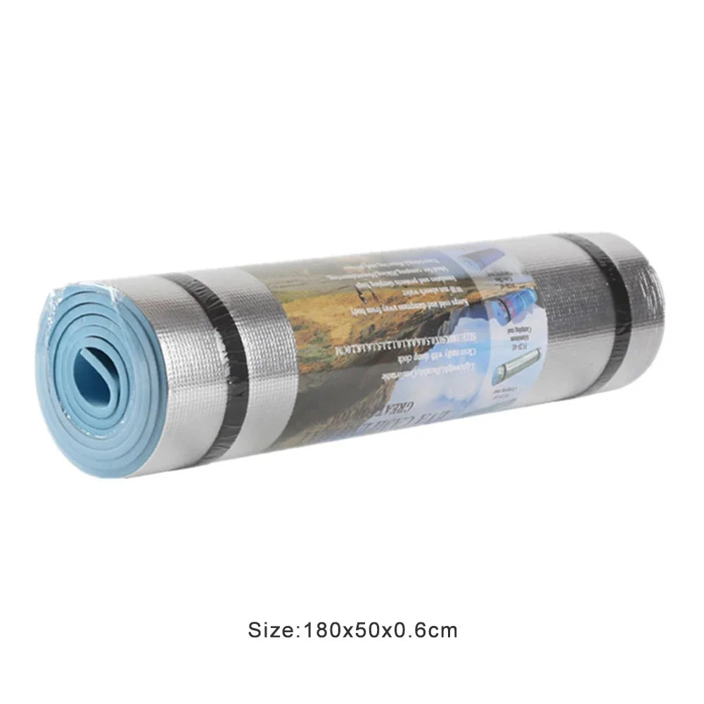 Athletic Sanctuary EVA exercise mat in gray, 1800x500x6mm, moisture-proof yoga and camping mat laid flat on a wooden floor.