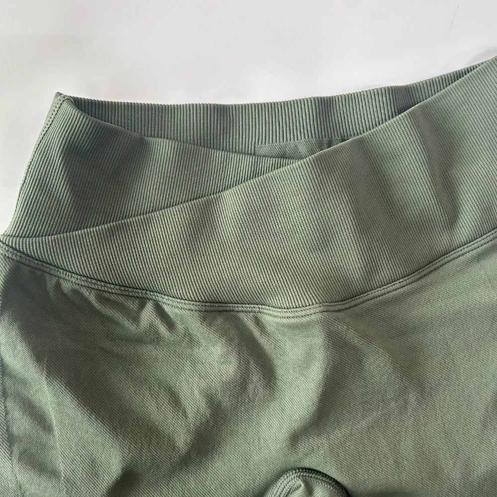 Athletic Sanctuary flared yoga leggings with high-waist and sculpting fit, shown on a model for comfortable movement and style.