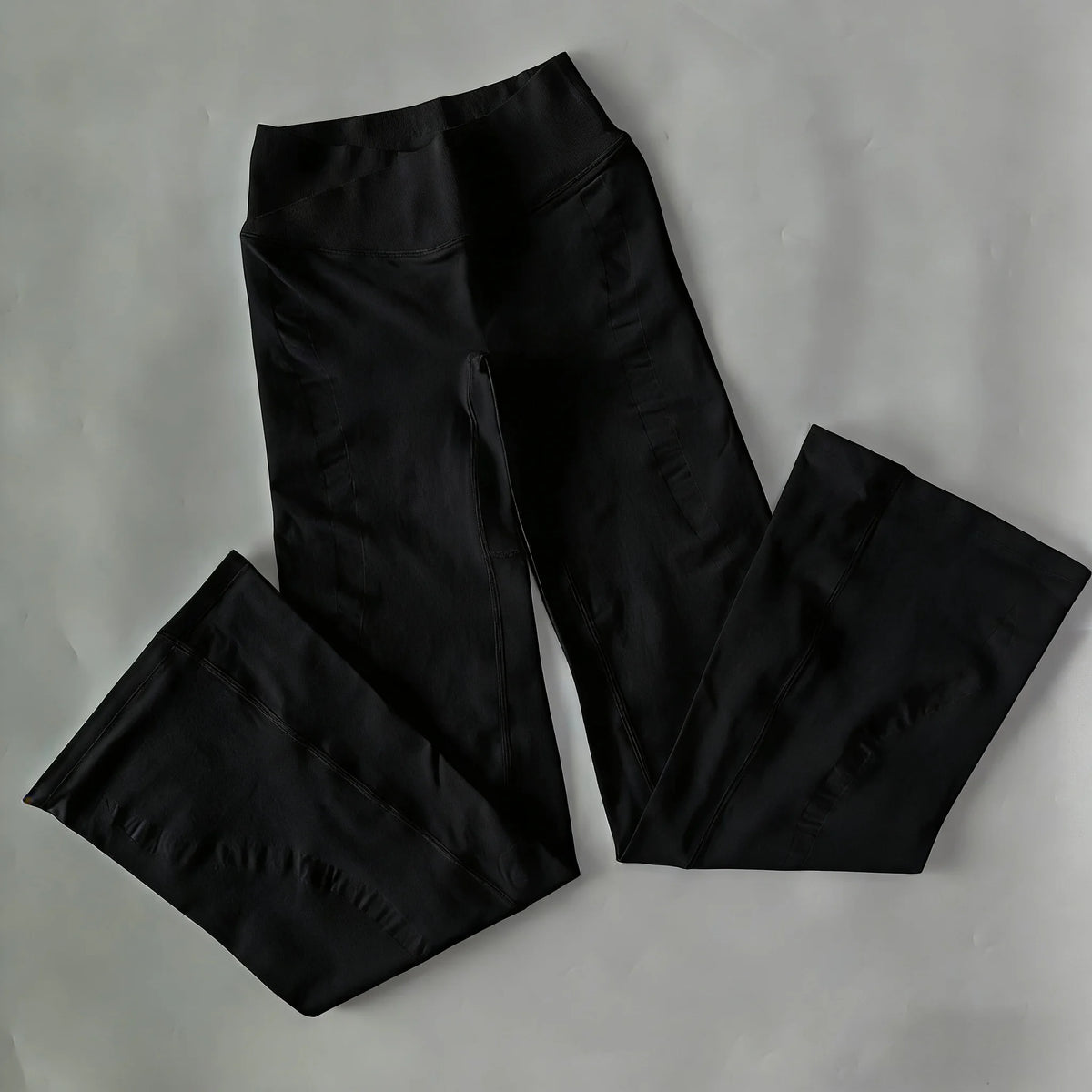 Athletic Sanctuary flared yoga leggings with high waist and sculpting fit, designed for comfortable movement and stylish activewear.
