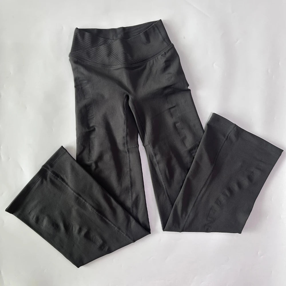 Athletic Sanctuary flared yoga leggings with high-waist design, showcasing their sculpting and comfortable fit for active movement.
