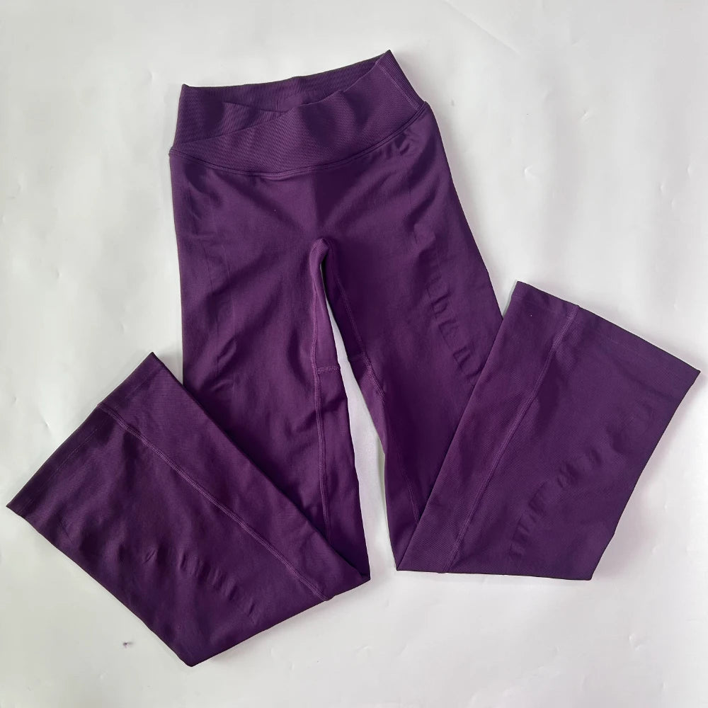 Athletic Sanctuary flared yoga leggings with high-waist design, showcasing a comfortable fit and sculpting fabric for active movement.