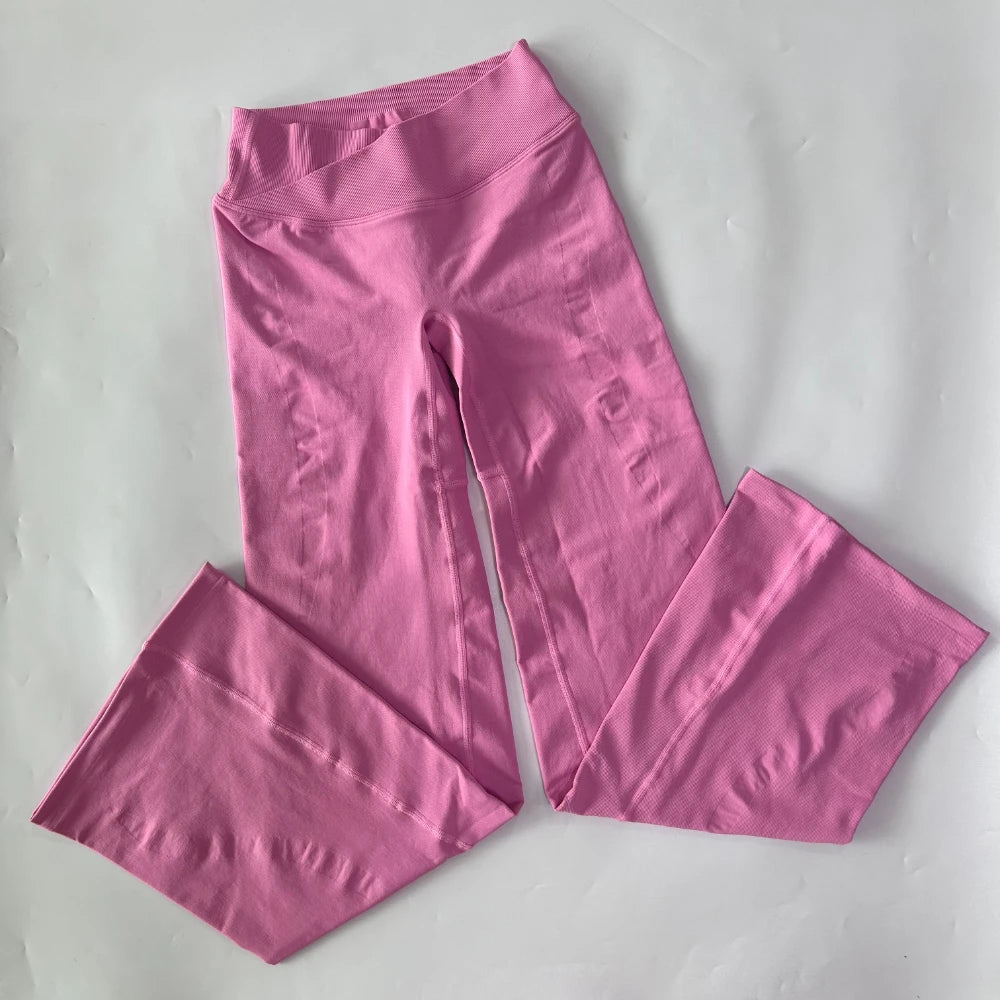 Athletic Sanctuary flared yoga leggings with high-waist and sculpting fit, shown on a model in a yoga pose.