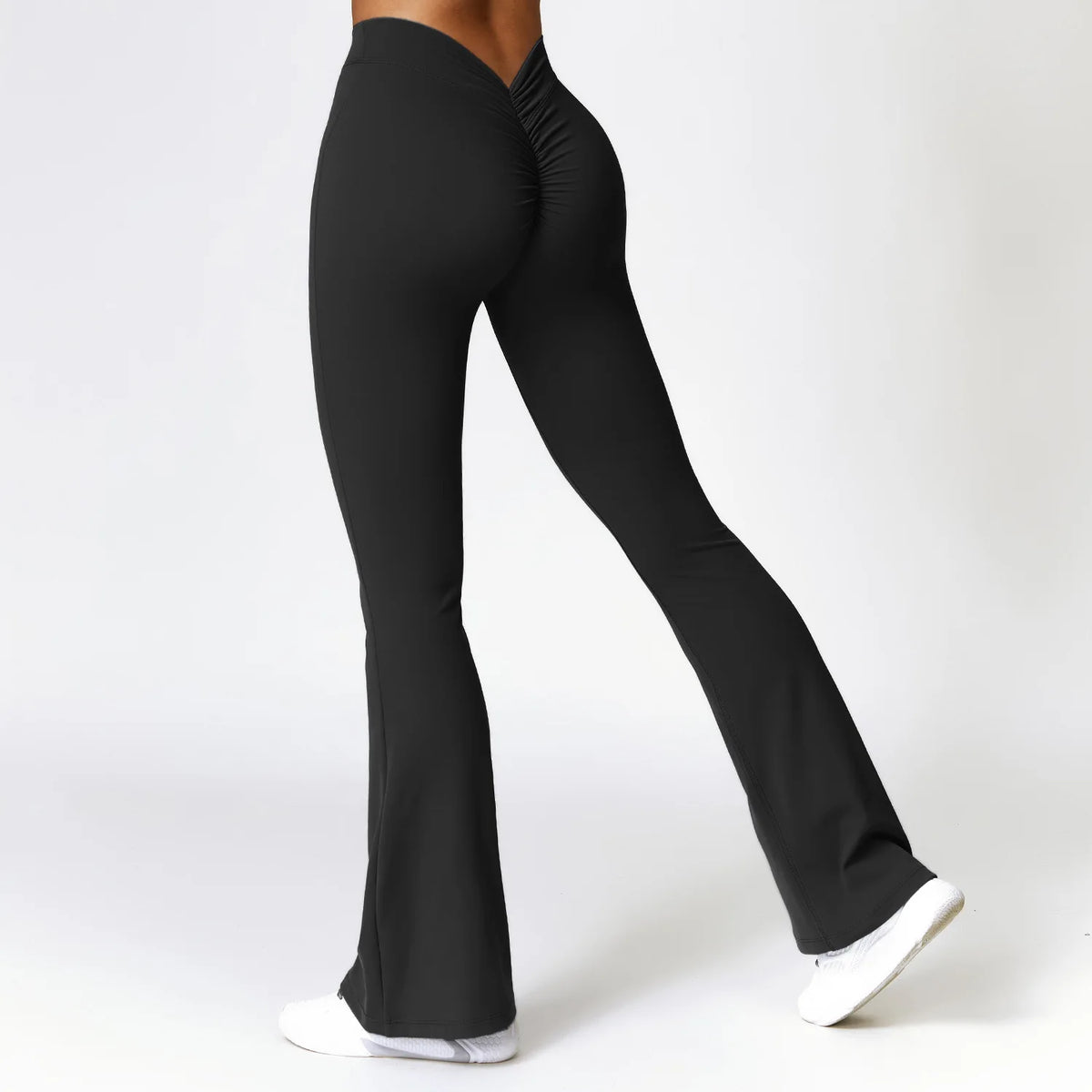 Athletic Sanctuary high-waist flare yoga pants with supportive fit, shown on a person standing, ideal for training and everyday wear.