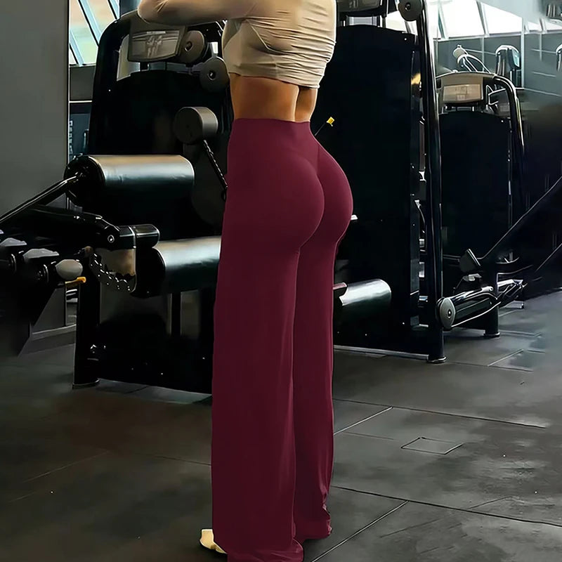 Women's wide-leg yoga pants by Athletic Sanctuary with high waist and tummy control, shown in a comfortable, relaxed fit.